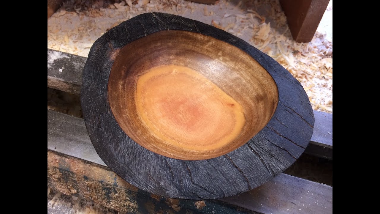 Richard Raffan turns and burns to create a natural edge bowl.