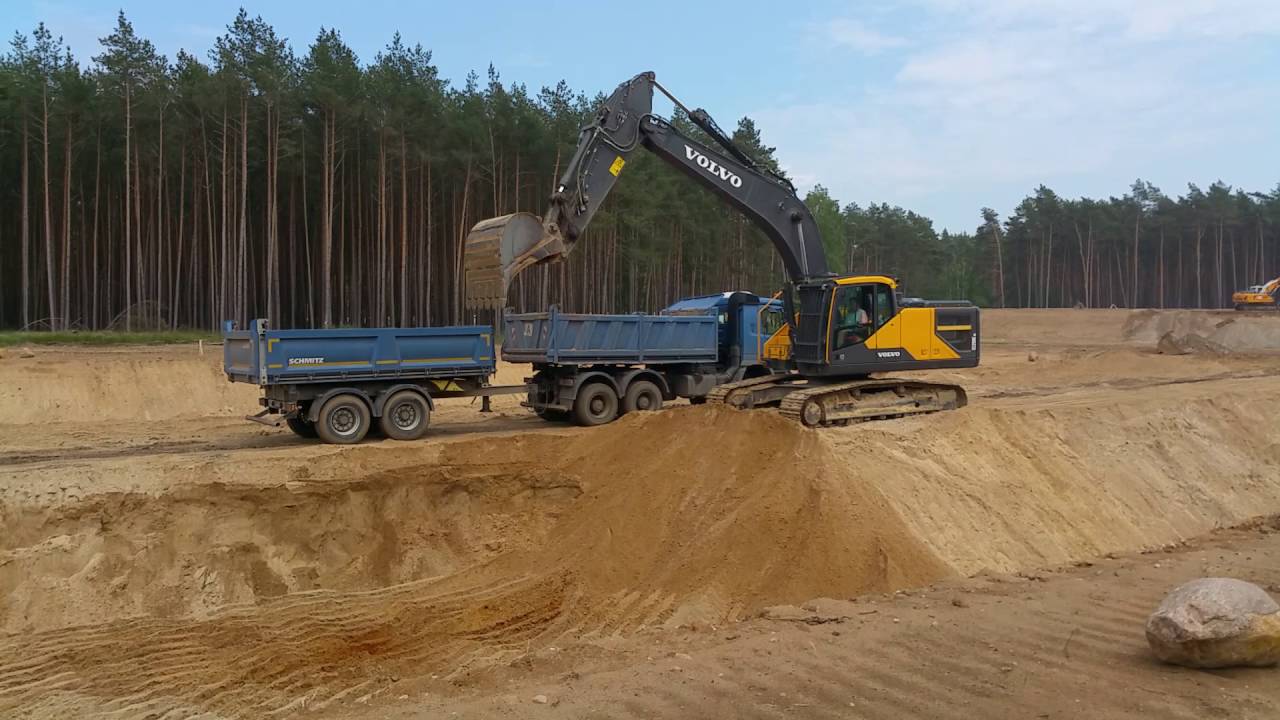 VOLVO EC250E loading MAN and MERCEDES trucks