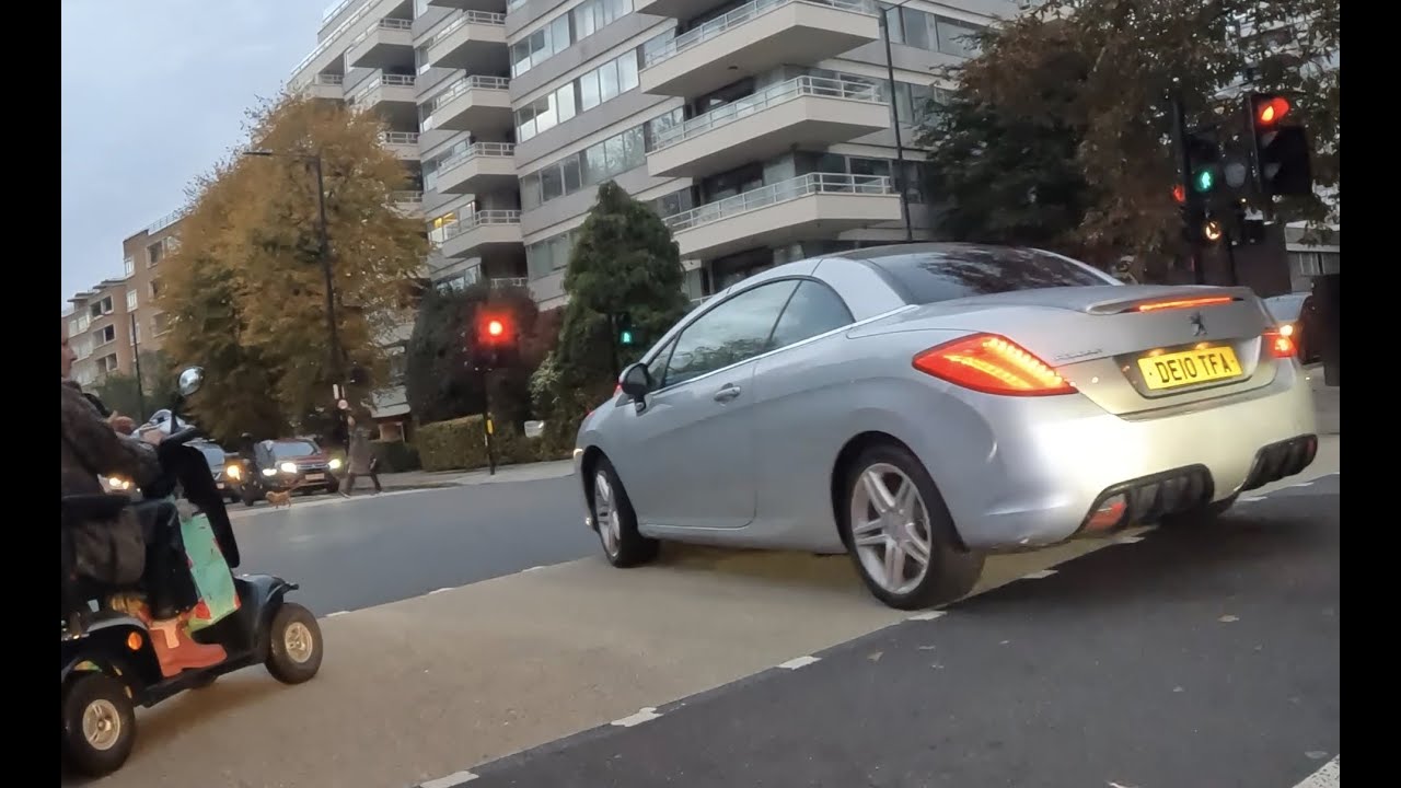 Wheelchair user blocked by Peugeot man! One thing is to run a red light, but blocking a wheelchair?