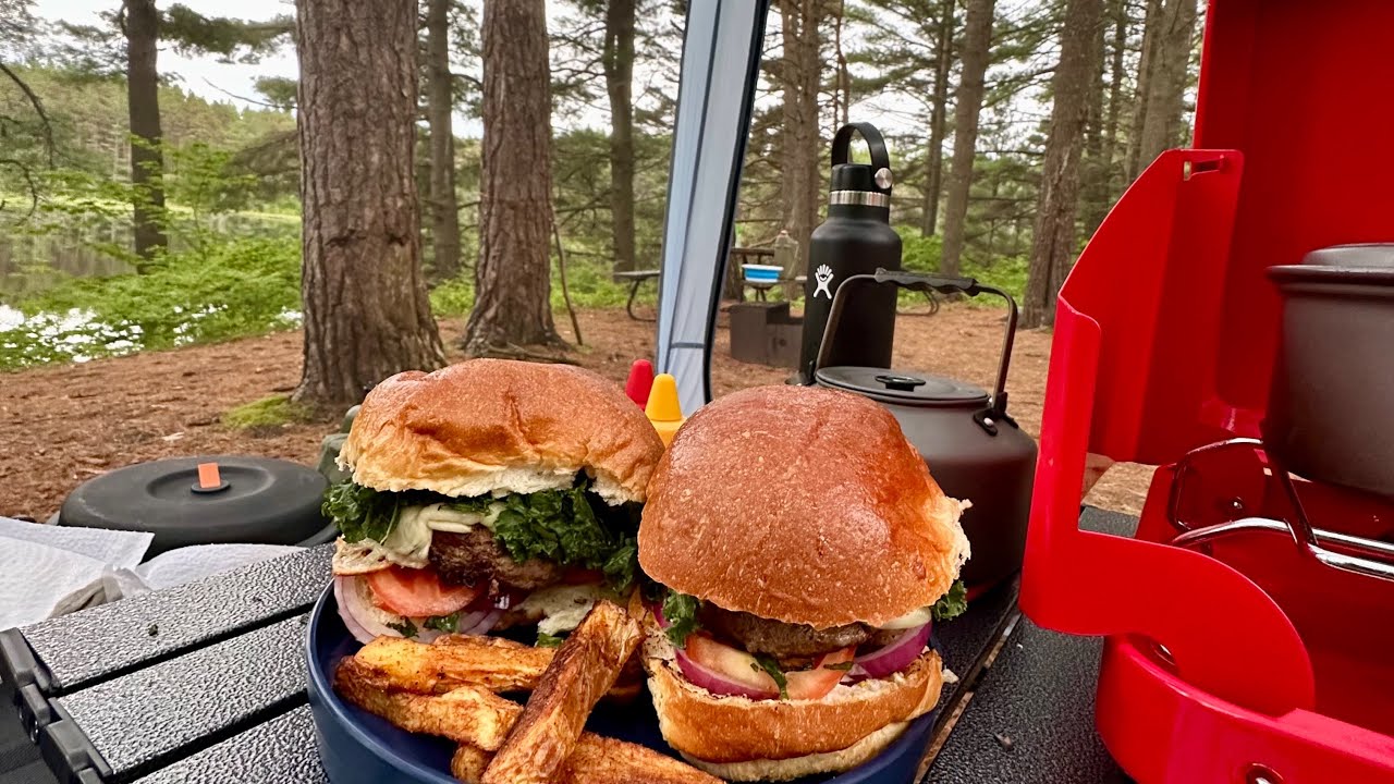 Preparing burgers and fries inside the Coleman Skyshade™ 8 x 8 ft. Screen tent - Pog Lake Campground