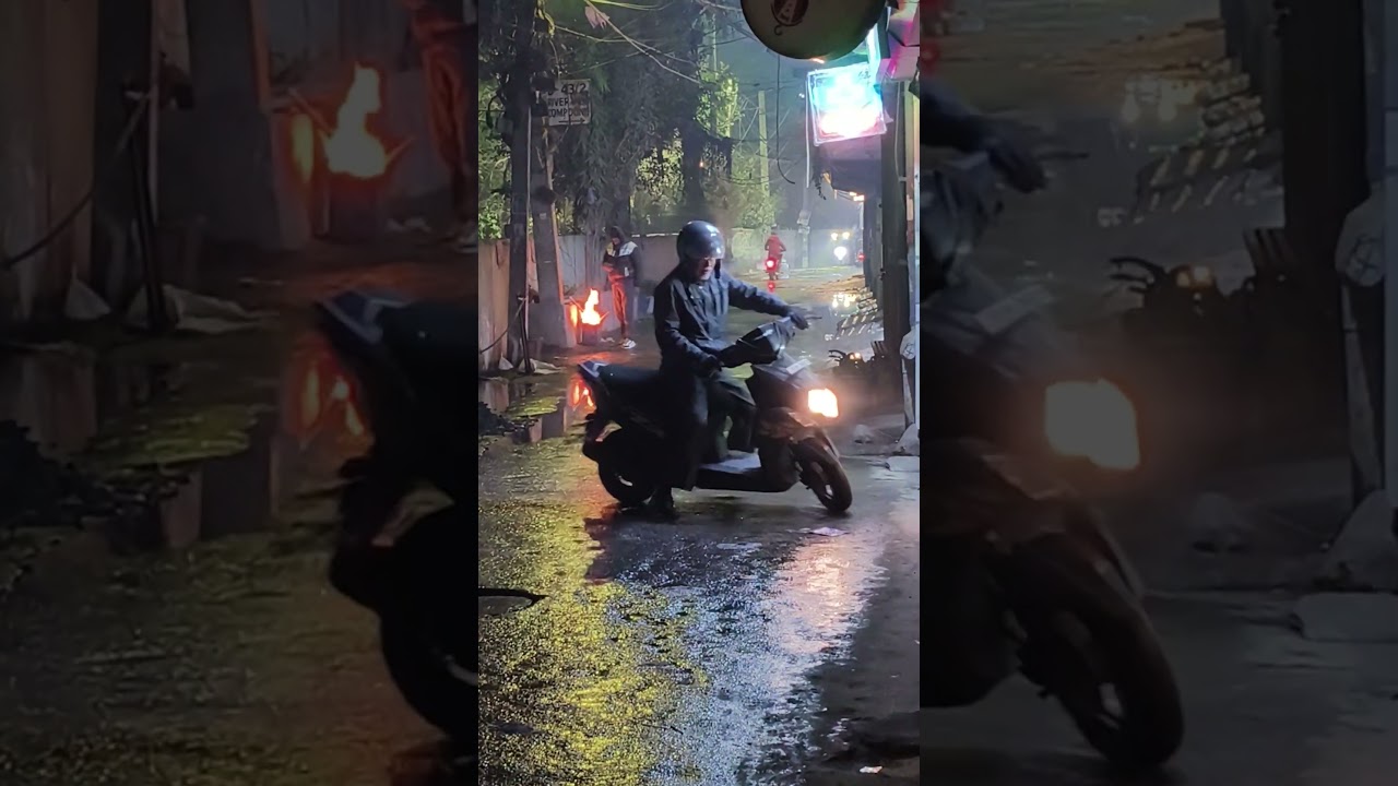 A cold Delhi night pauses the city—rain, silence, and streetlights reminding us to slow down.