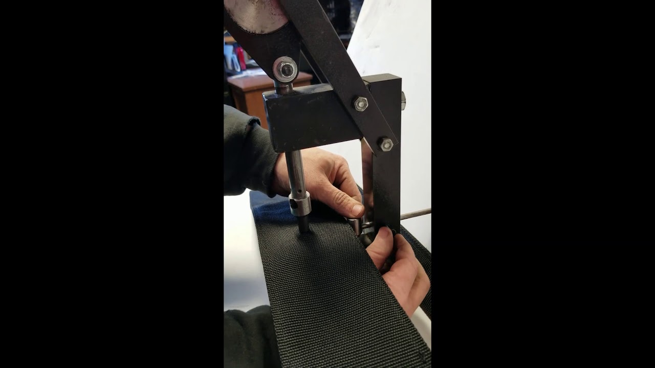 Handyman Press Punching 38 Holes in Thick Webbing