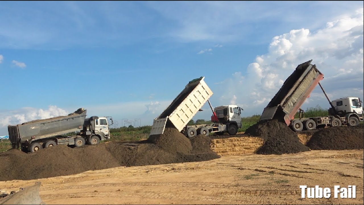Bulldozer Pushing and Dump truck Unloading Sand | Modern road machinery processing