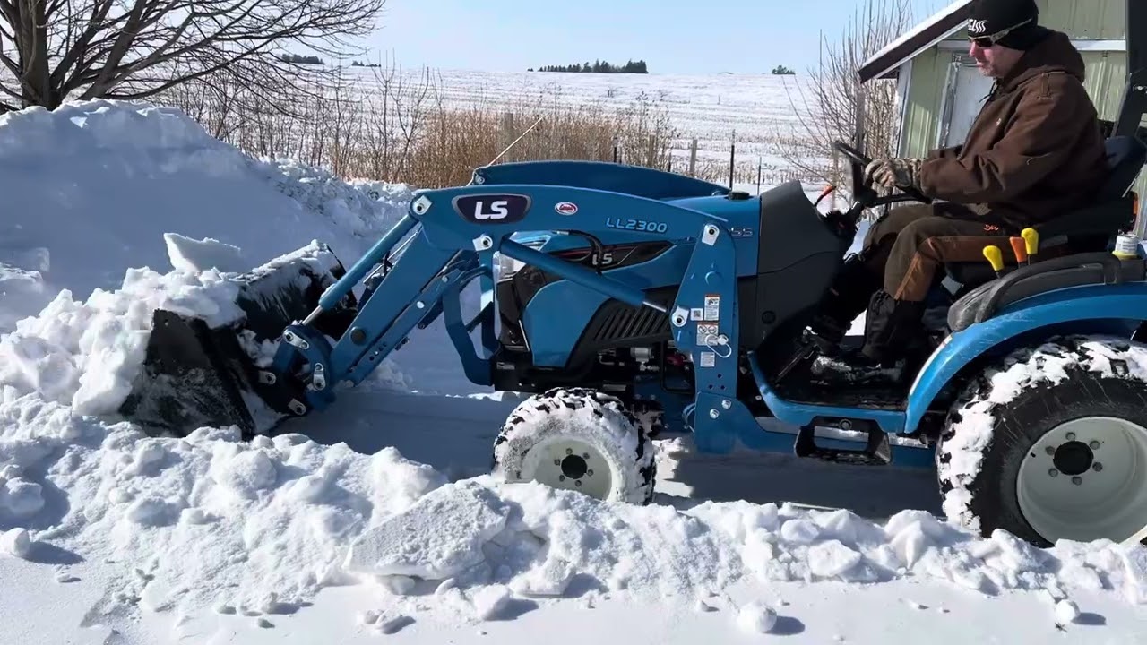 LS MT225s moving snow.