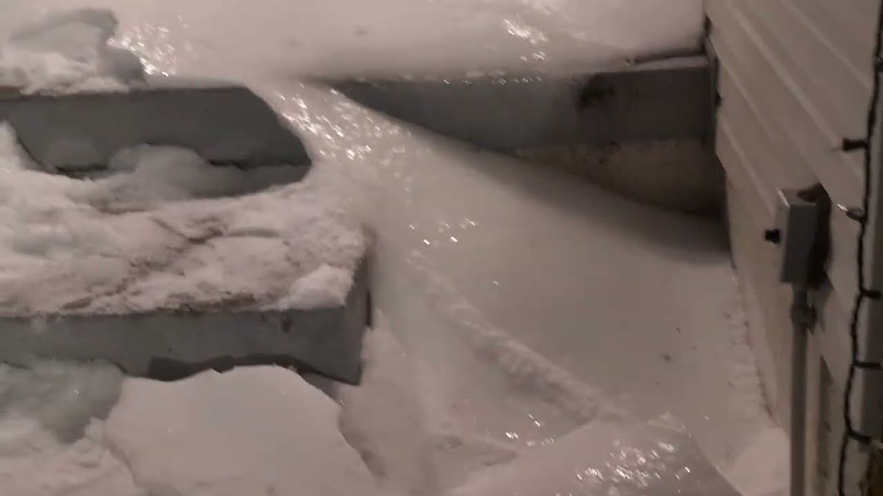 Breaking the ice (snow) in front of the house