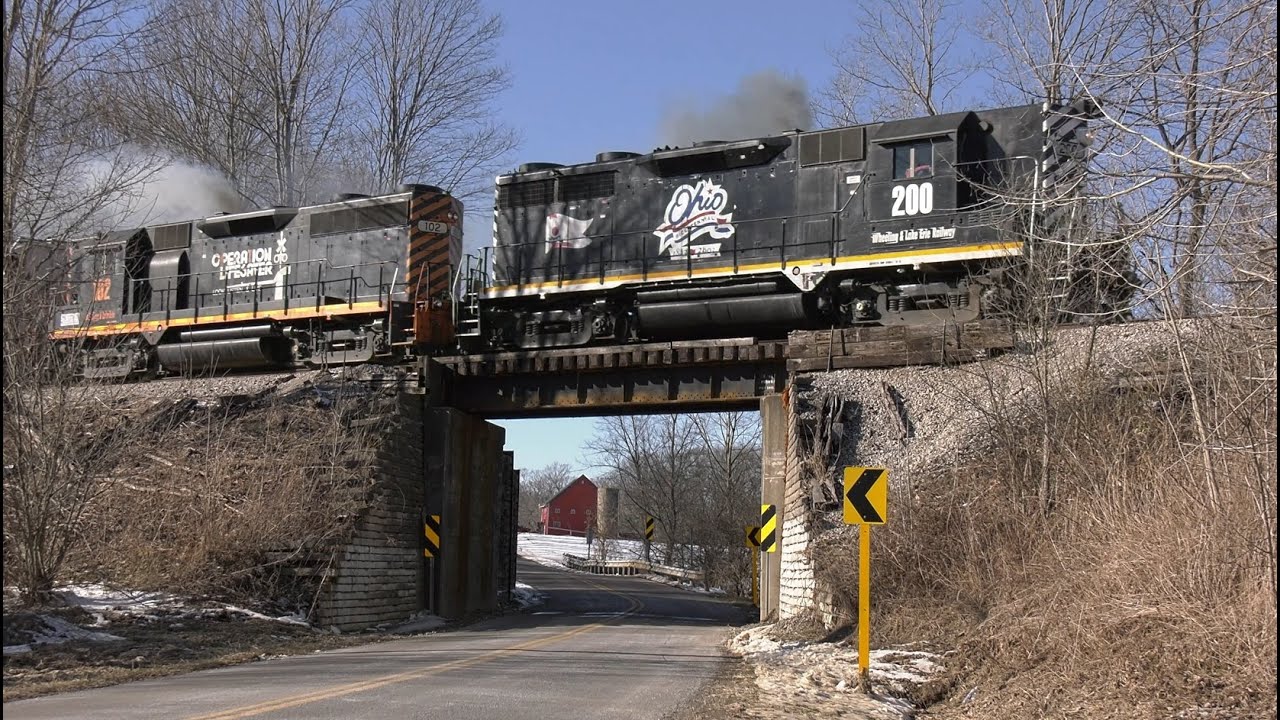 W&LE 102 Operation Lifesaver and W&LE 200 Bicentennial Highhood GP35 pair in the snow EMD GP35