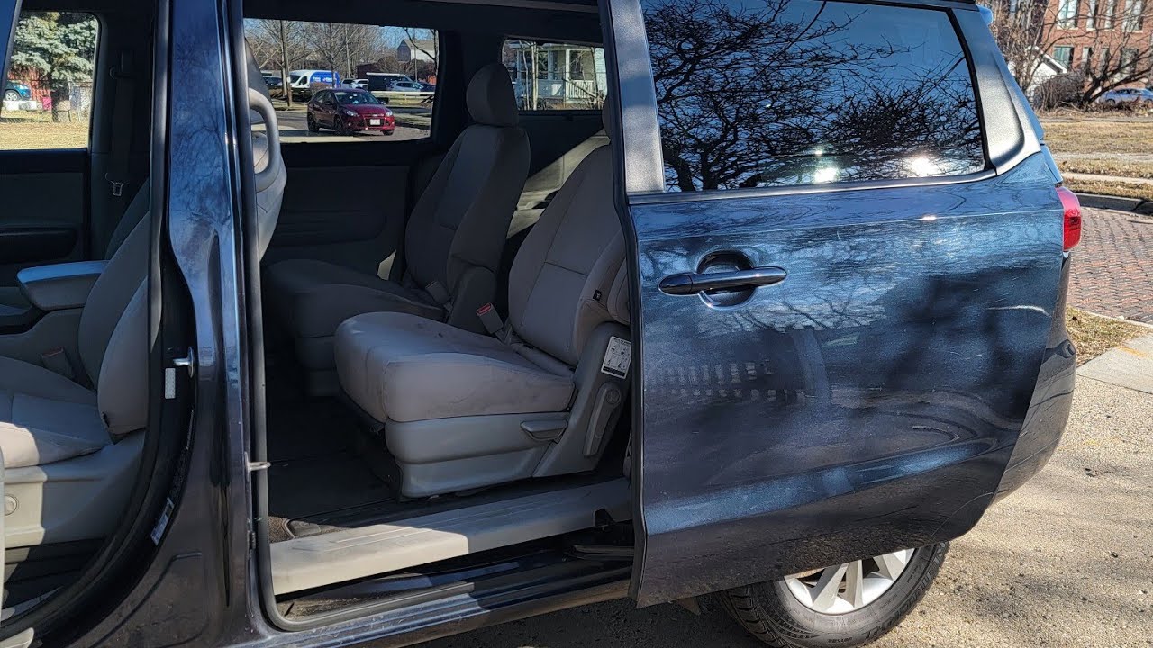 2015 kia sedona como activar las puertas automaticas