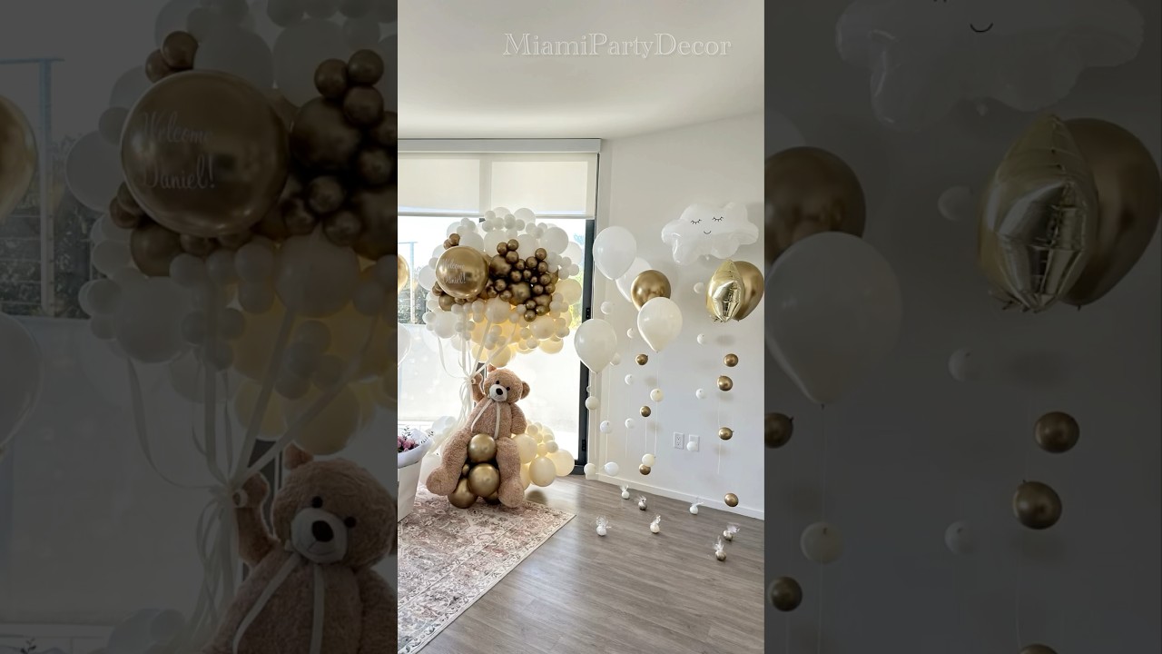 Teddy bear welcome home setup with dreamy floating balloons and golden vibes!