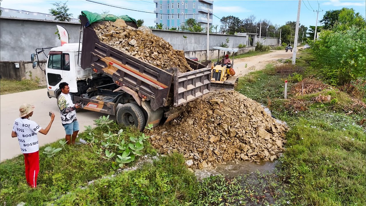Good skill and nice filling technique dump trucks and bulldozer filling land