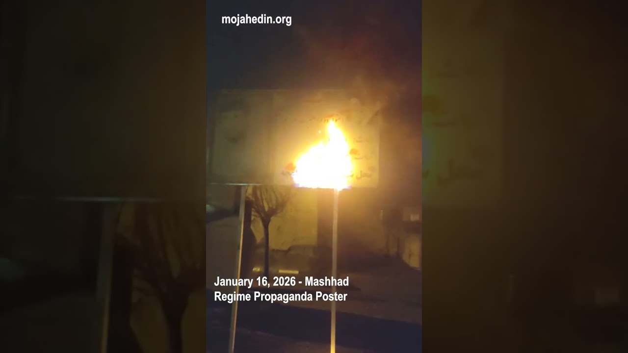 Protesters set fire to regime propaganda poster in Mashhad | Iran protests