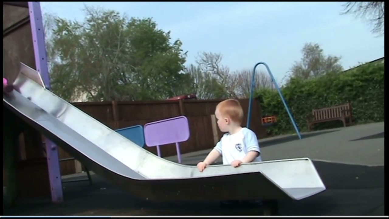 Harry plays on the slide