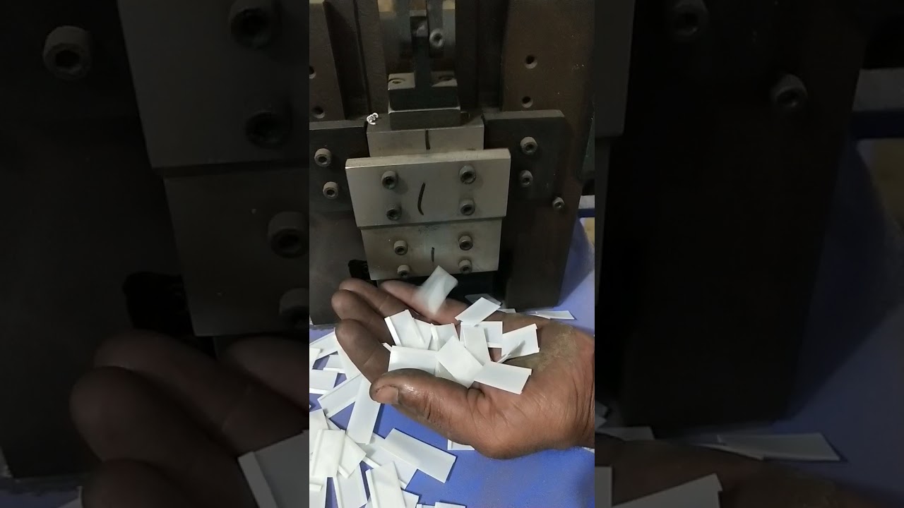 Paper folding and cutting machine