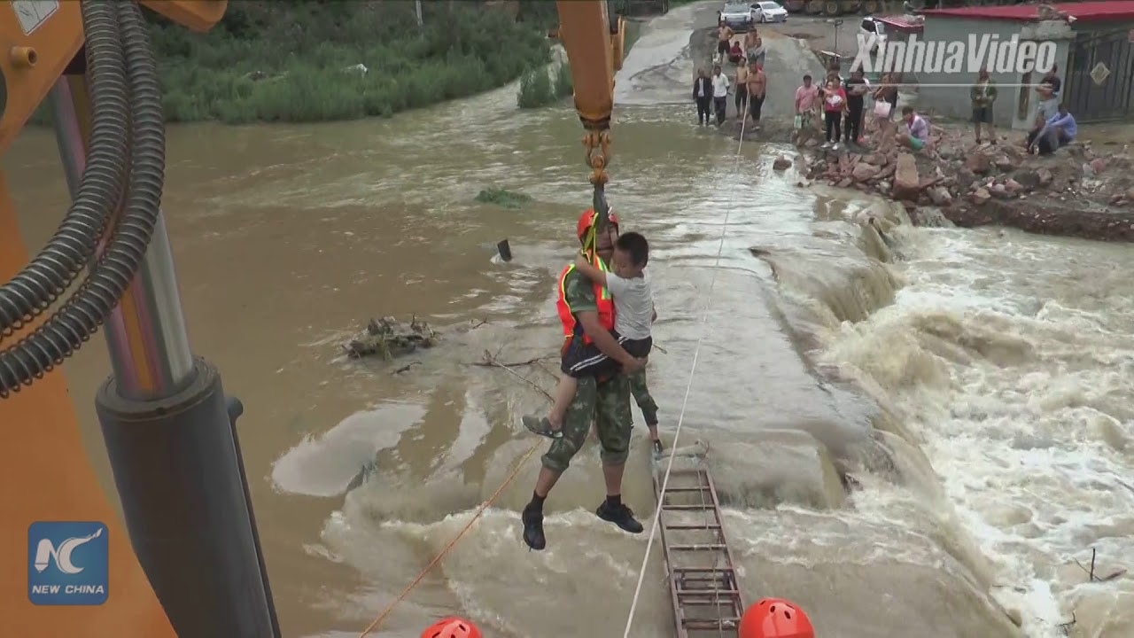 Everyday heroes! Firefighters rescue sick kids trapped in floods