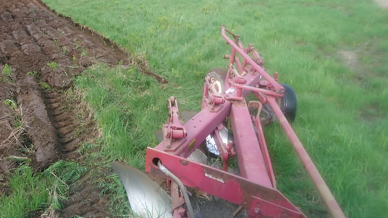 Plowing a corn field