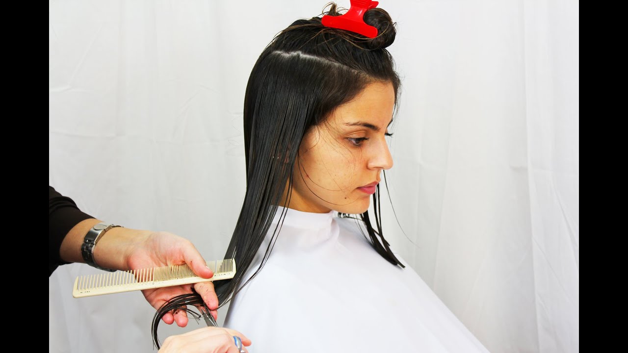 Wonderful brunette getting a long straight bob haircut