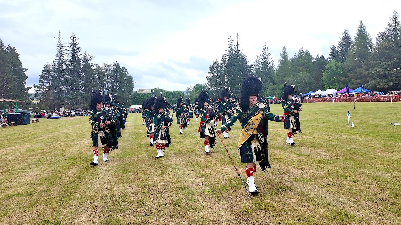 Huntly Pipe Band march in playing 8th Argylls on the march during 2025 Tomintoul Highland Games