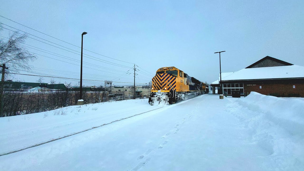 Double arrow on ONR 214 passing thru the train station with units ONR 2120 leading, and ONR 2121