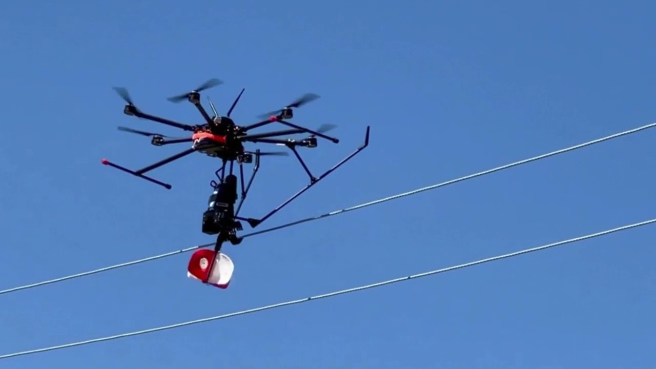 UAV Drone Installs Power Line Marker Bird Diverter