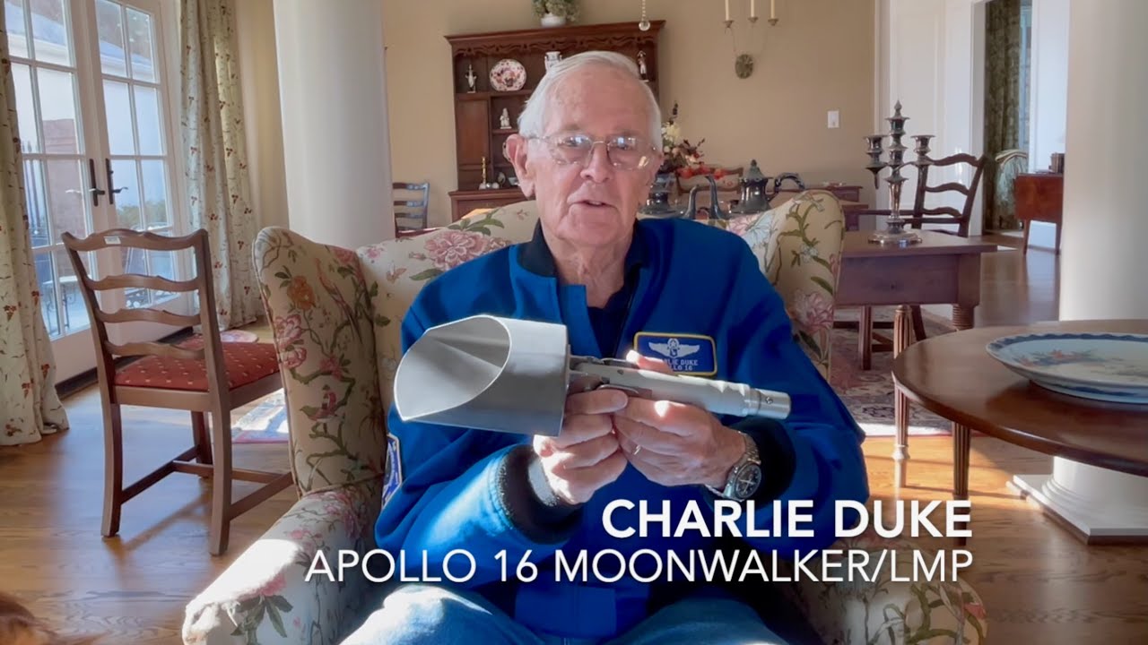 Charlie Duke holding the Apollo 16 Lunar Scoop