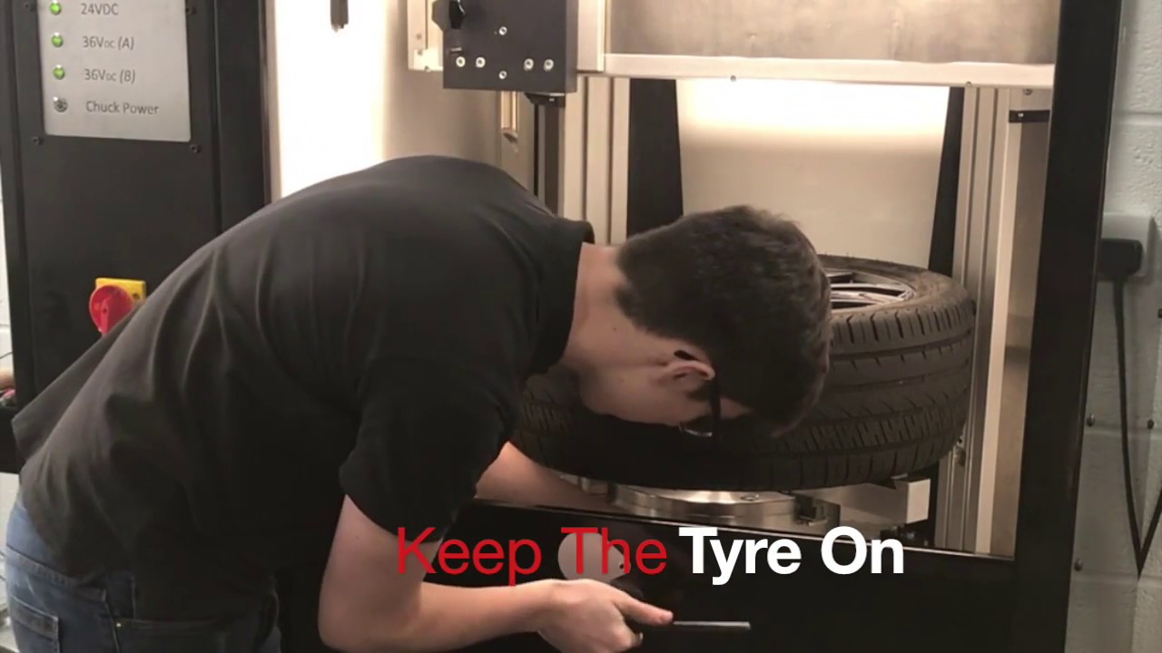 Mobile Diamond cut wheel lathe DC2  refinishing an alloy wheel with the tyre still on Wheel