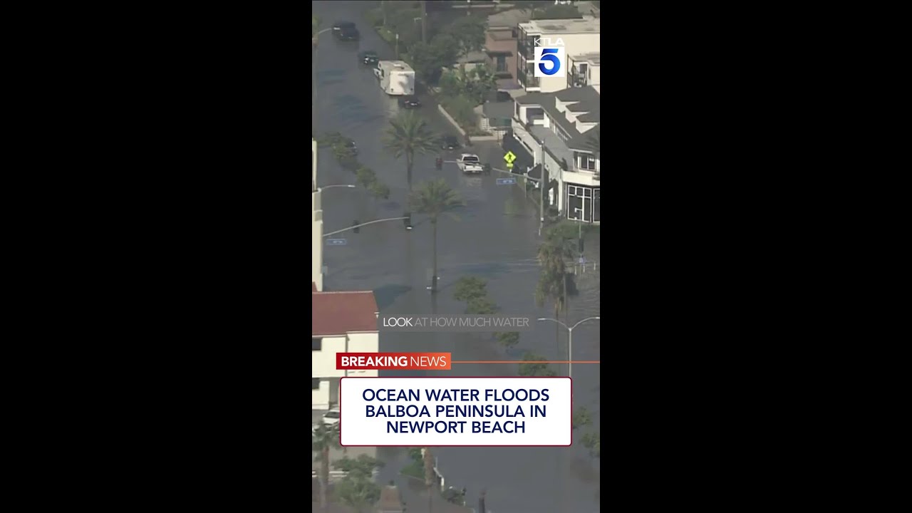 Ocean water floods Balboa Peninsula in Newport Beach