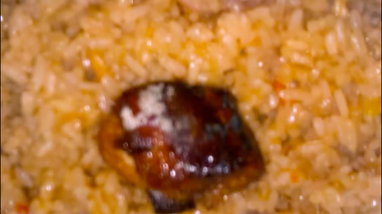 Peppered Jollof Rice with snake Tomatoes 