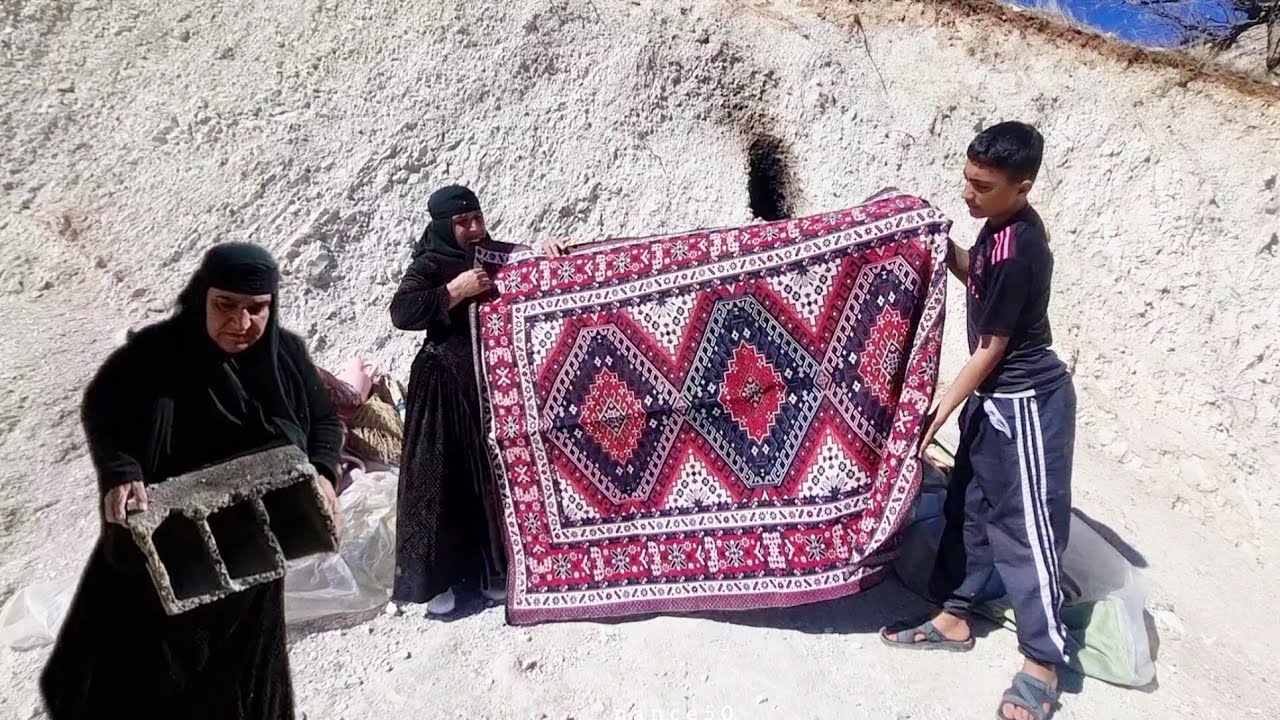 Videographer, helping grandmother and her child in mountain cave