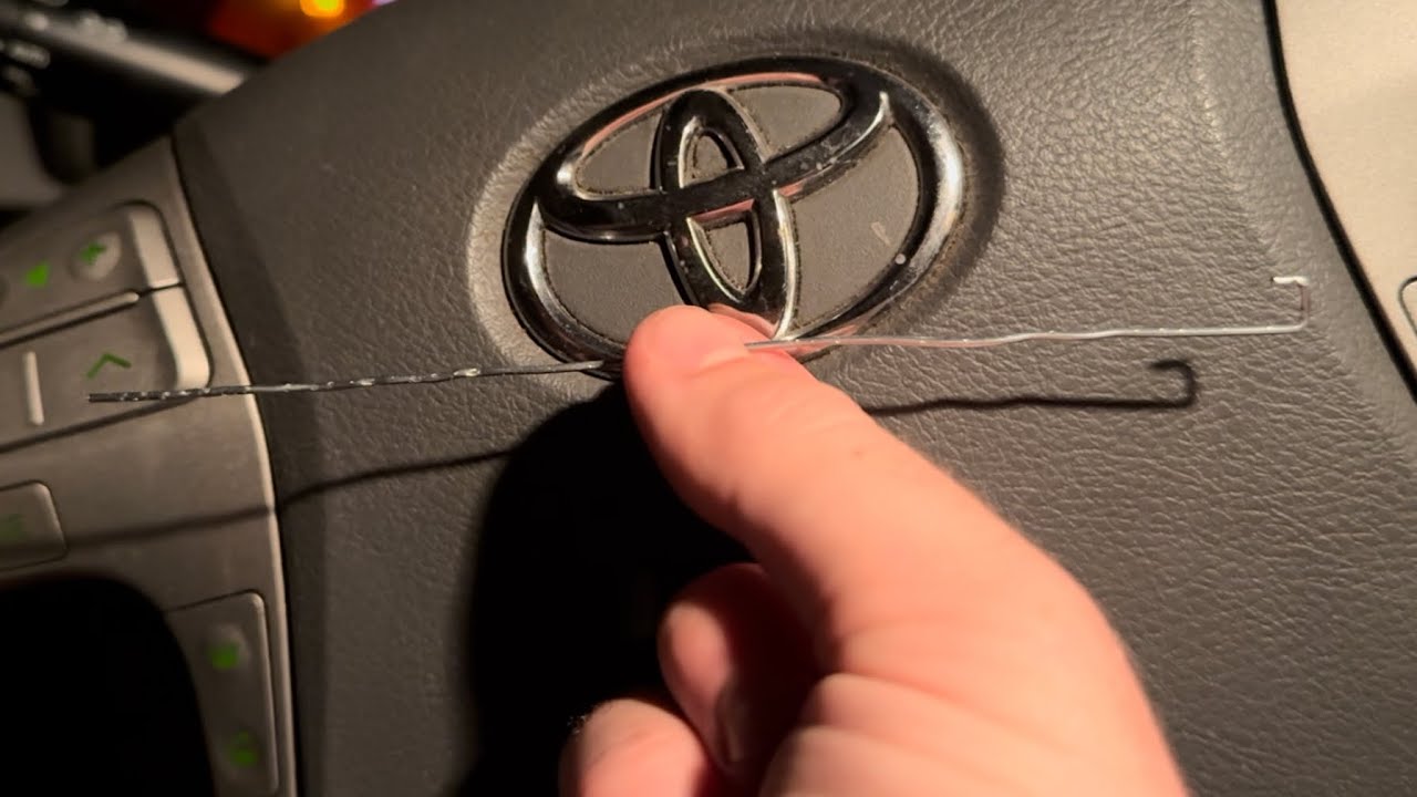How to extract a stuck CD (Pearl Jam - Ten) from a car (Toyota Camry 2007)
