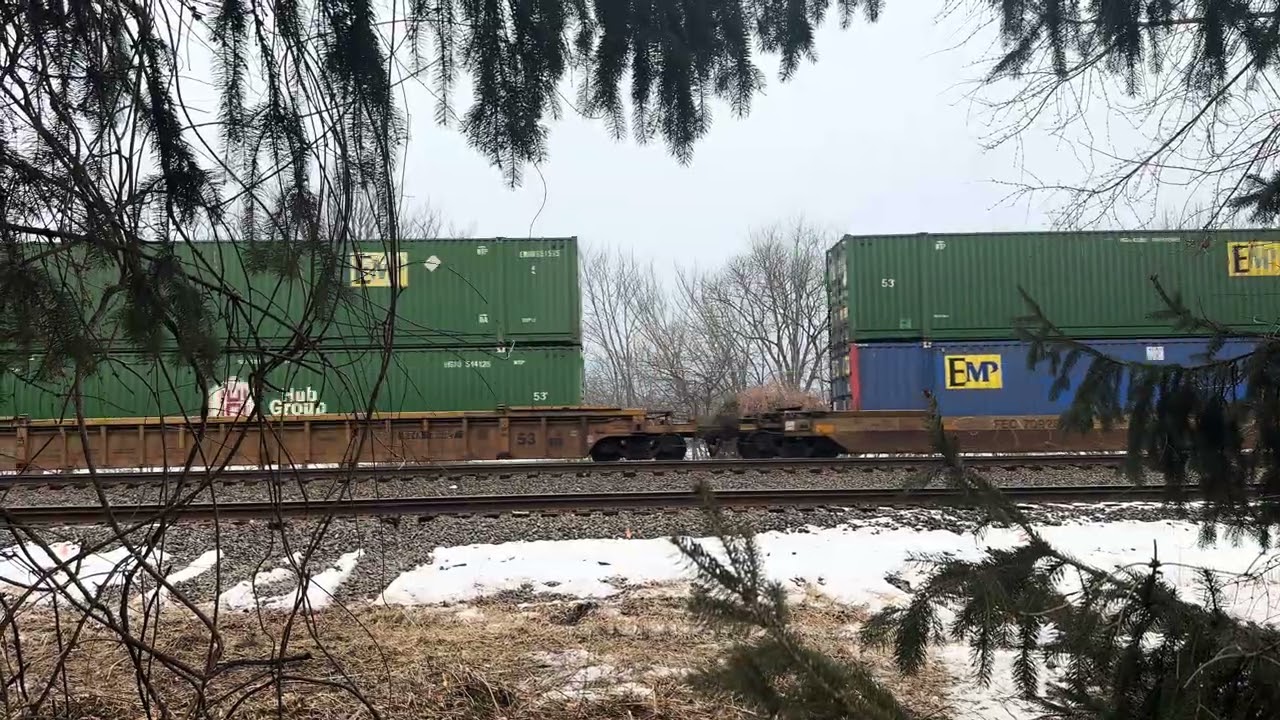 NS intermodal through the trees at Sheetz in Cove Pa