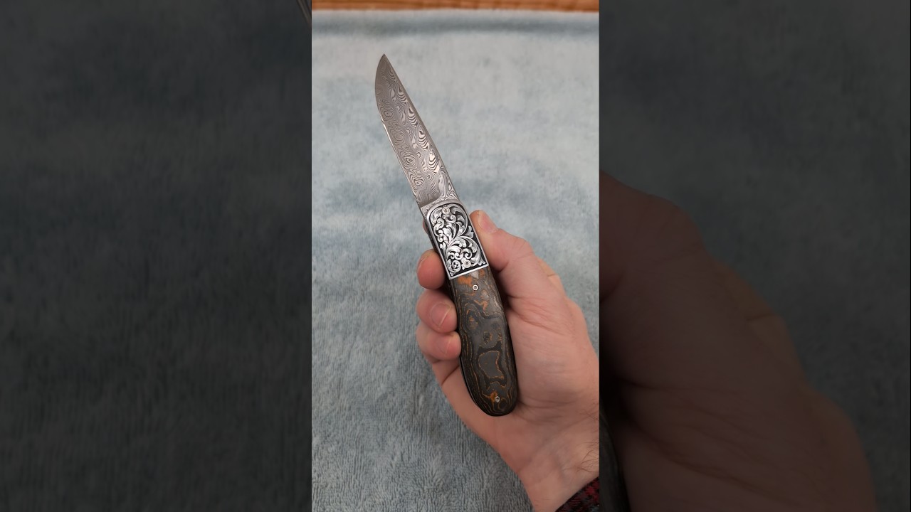 Engraved Aquilo Front Flipper with Neon Orange CamoCarbon - Stainless Damascus by Neels Roos