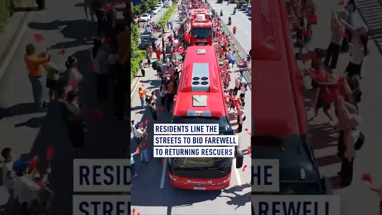 Residents line the streets to bid farewell to returning rescuers