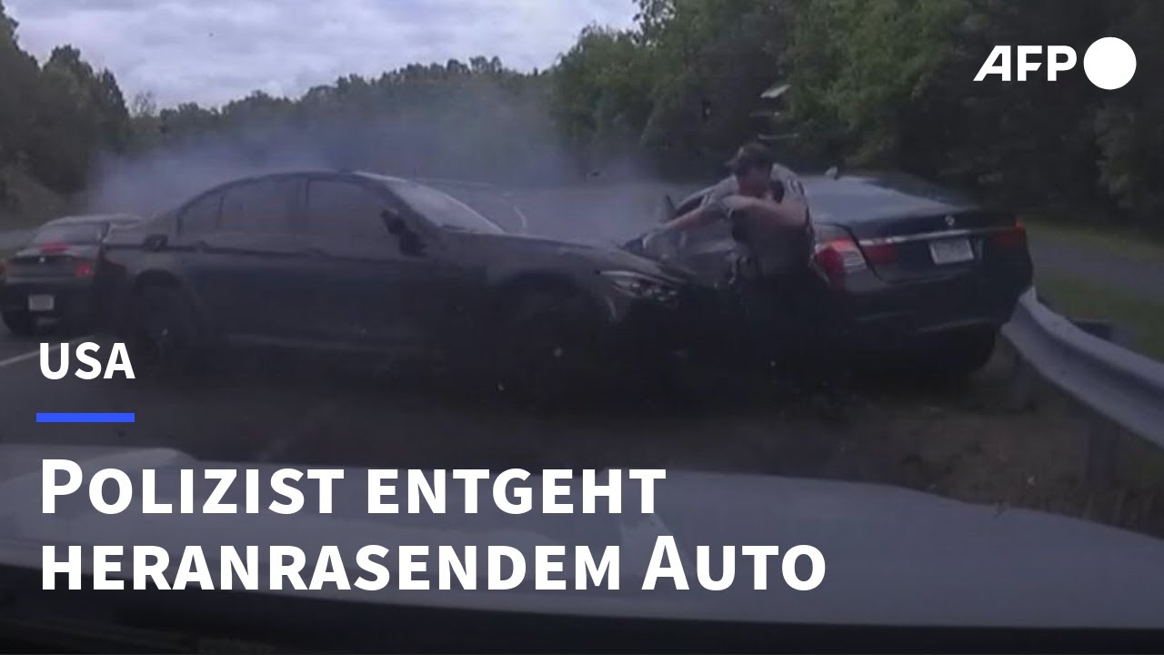 US-Polizist entgeht haarscharf Unfall bei Verkehrskontrolle | AFP