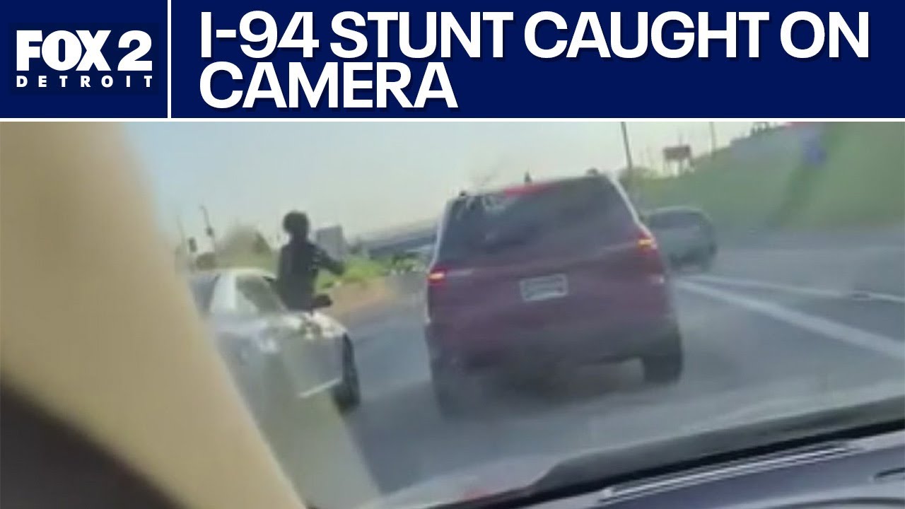 Detroit driver captures two people passing alcohol between cars while driving