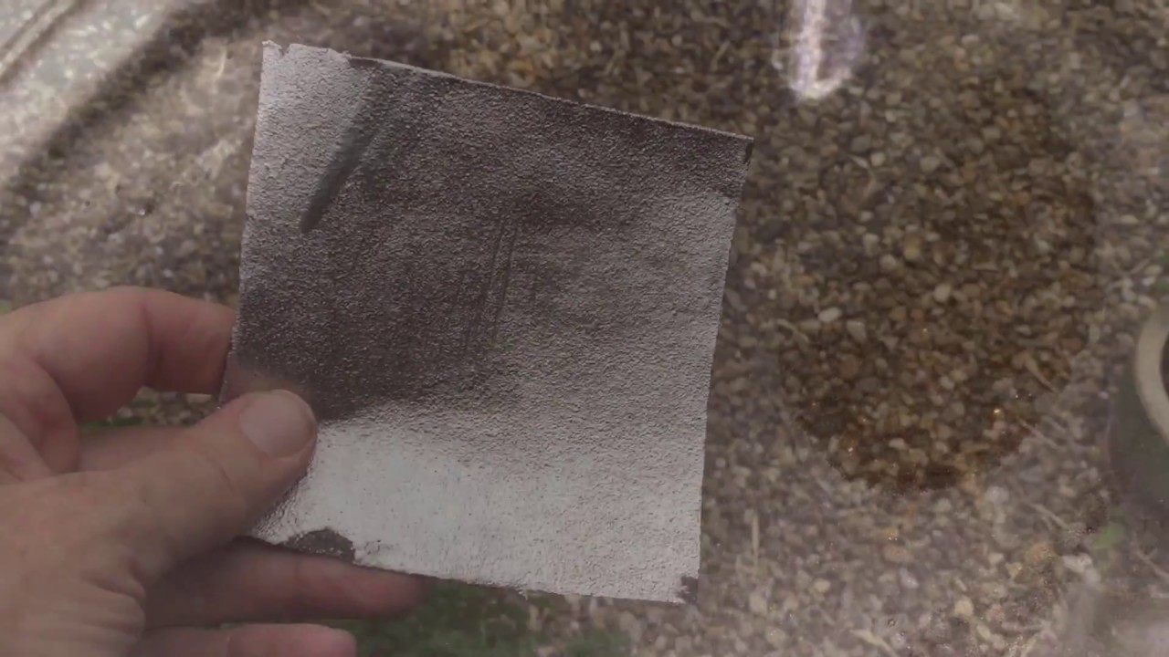 Flat roof re-coated with solar reflective paint. Mastic asphalt. UK. Everbuild Black Jack