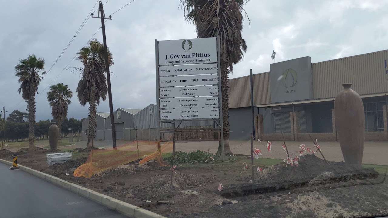 Driving Sir Lowry's Pass Road through Township and past polling station, South Africa, 2019-05-08