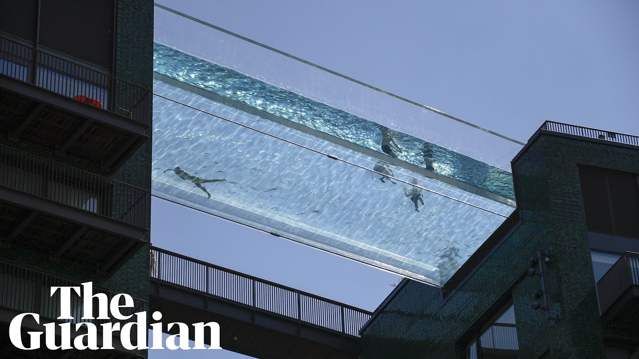 Londoners cool off in 'sky pool' suspended 115ft in the air between two buildings