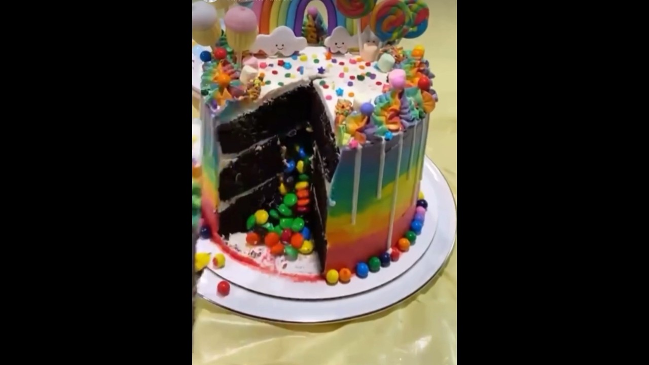 How to do a candy spill cake!🍭 #spillcake #explosioncake #rainbow #m&m #cakedecorating #tutorial