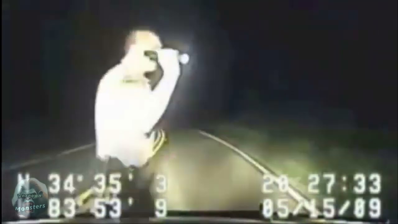 A Cop Cam captures footage of a Bigfoot crossing a road in Lumpkin County, GA, in 2009