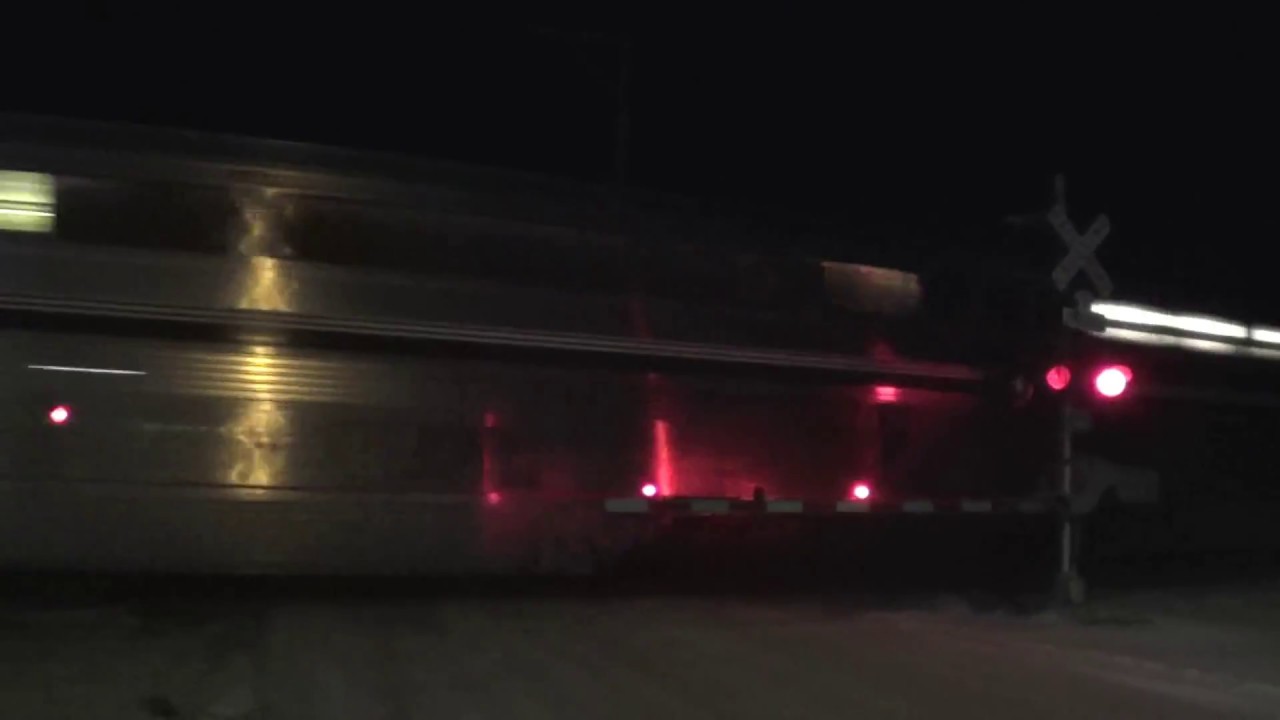 Executive MAC Leads Amtrak with Ski Train Cars at Night