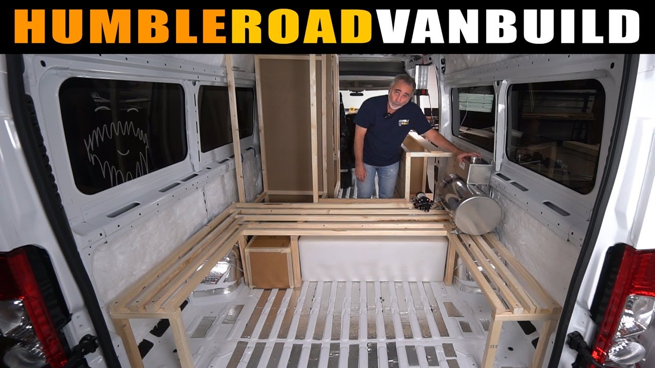 Massive storage & hidden shower found in this cardboard van build