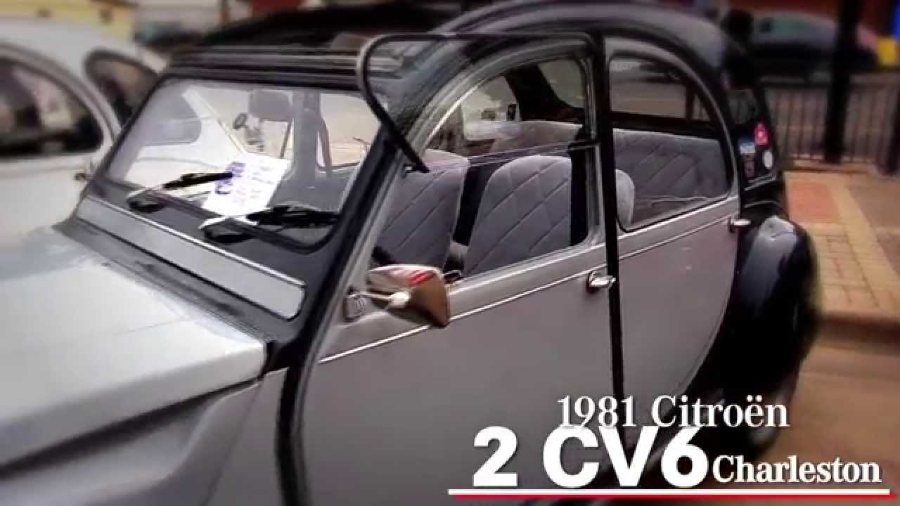 Dave Tobin talks with Citroen 2CV owner Herb Grika at the Intermarque Spring Kick Off Car Show
