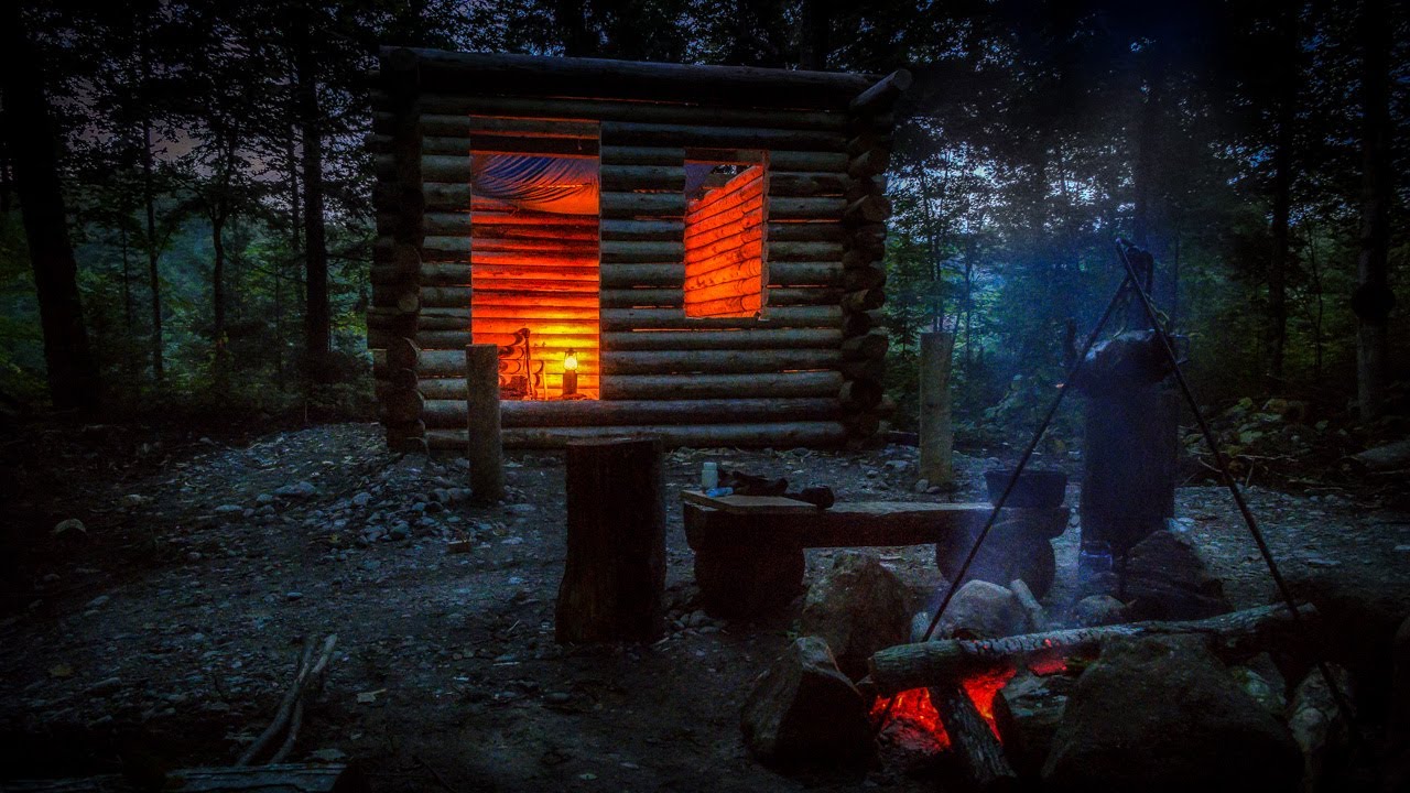 Primitive Log Cabin in the Forest Alone in the Wilderness with Hand Tools