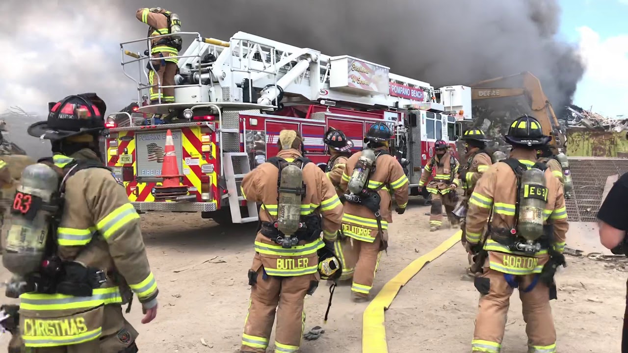 POMPANO FIRE DEPARTMENT BATTLING A SCRAP METAL YARD FIRE ON POWERLINE ROAD IN POMPANO BEACH, FL.