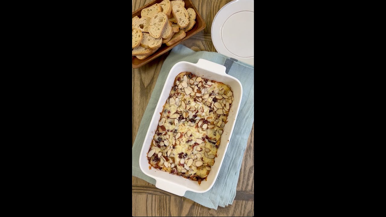 This warm, rich and creamy cranberry and bacon cheese dip will wow your party guests!  