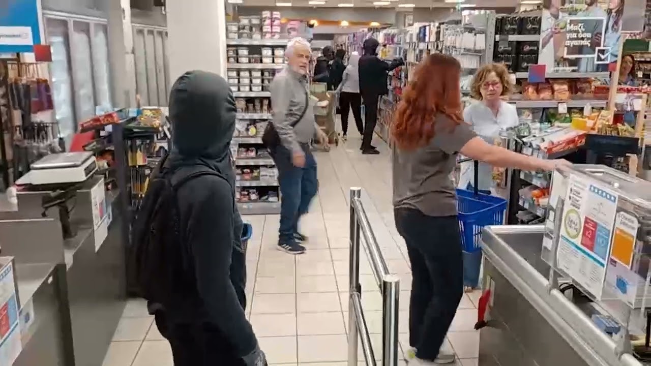 GREEK ANARCHISTS  RAID super market in Athens, to appropriate products for flood stricken people.