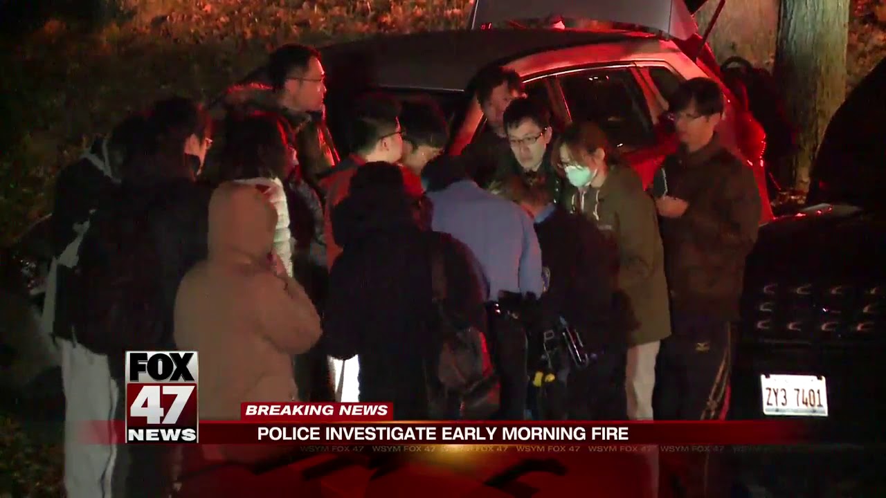 Lansing Police rescue students trapped in massive house fire, firefighter injured