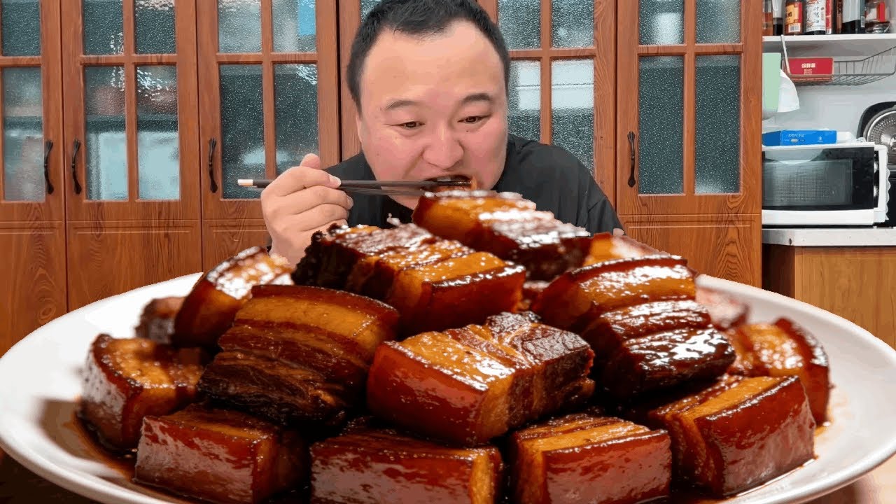 Ah Qiang makes a special braised pork belly that melts in your mouth.