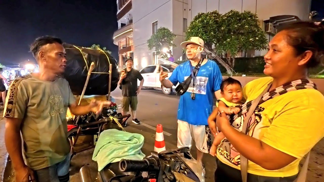 Walking by the Mekong riverside during Lao new year festival 