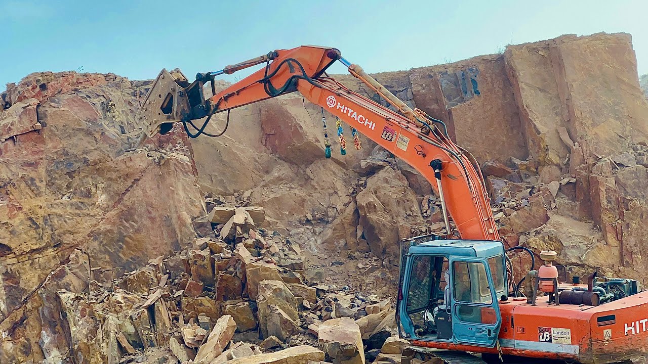 WATCH THE ACTION UNFOLD: Excavator Takes on a Massive Hill