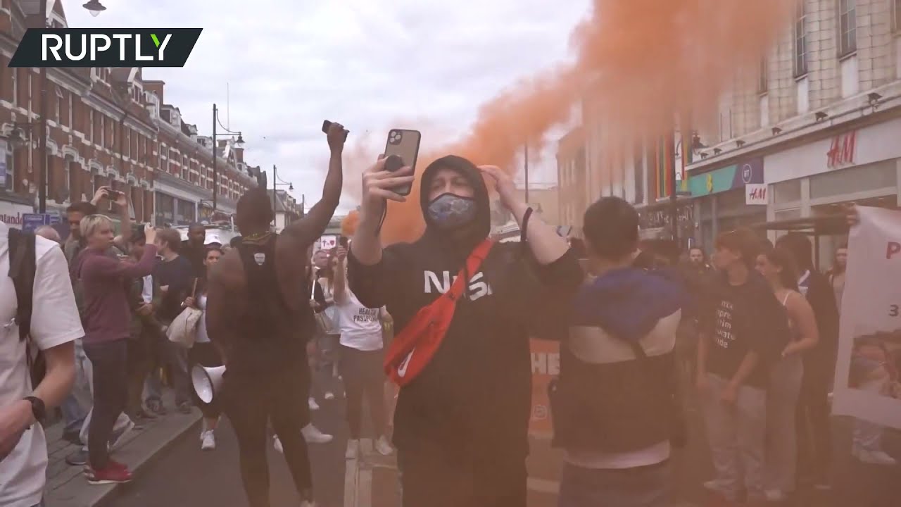 Protesters march through London streets against vaccine passports